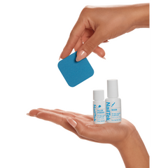 NailTek Nail Repair System components, including resin, filler powder, and a buffer, displayed in hand for scale.