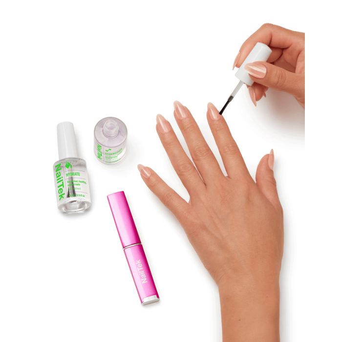 NailTek Nail Nutrition System applied for hydration and strength, enhancing nail flexibility and smoothness.